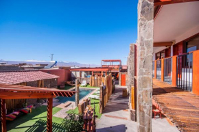 Отель Hotel Casa Algarrobo  Сан-Педро-Де-Атакама